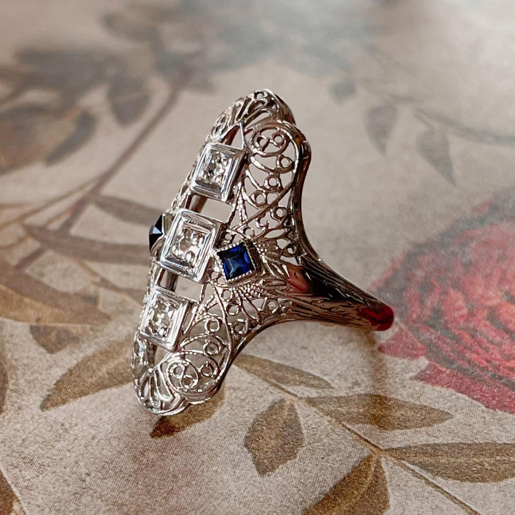 Art Deco 18k White Gold, Diamond, and Sapphire Filigree Shield Dinner Ring - Clover Collective Antiques