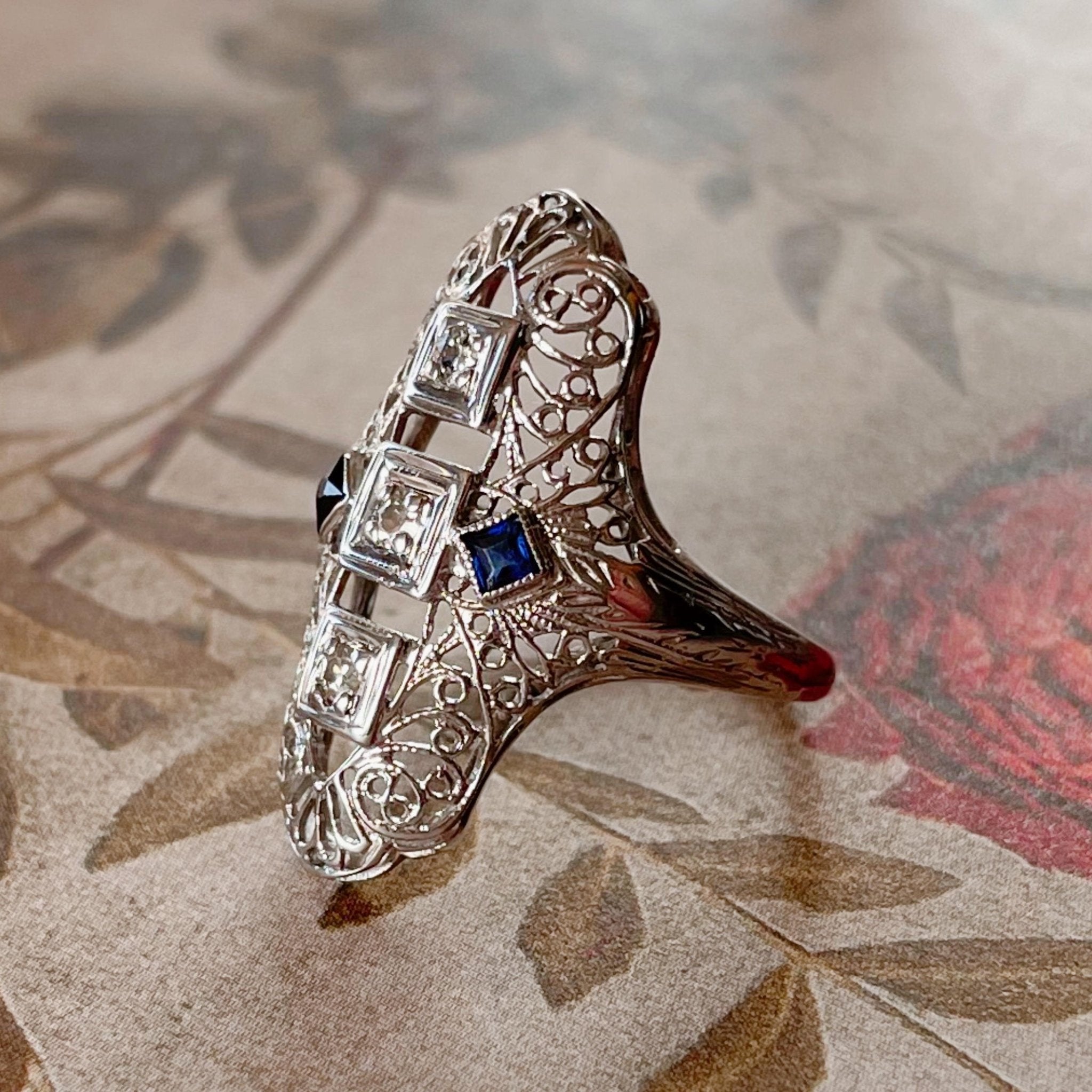 Art Deco 18k White Gold, Diamond, and Sapphire Filigree Shield Dinner Ring - Clover Collective Antiques