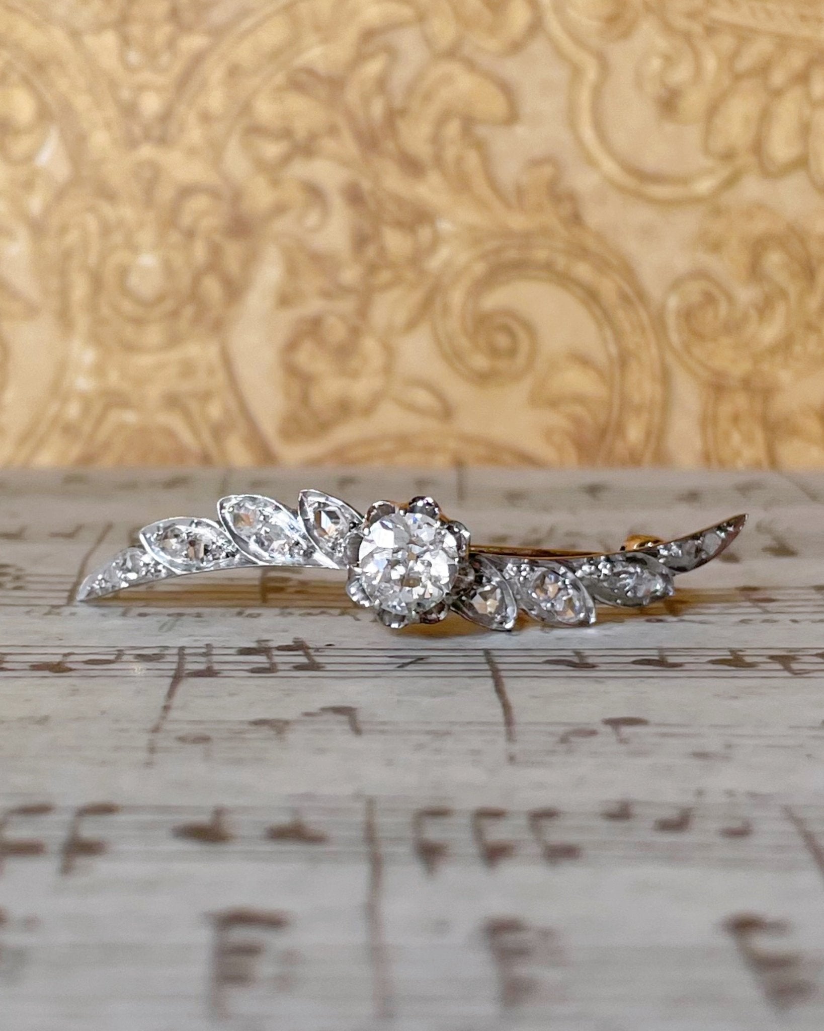 Edwardian Platinum, 14k Rose Gold, and Diamond Winged Brooch - Clover Collective Antiques
