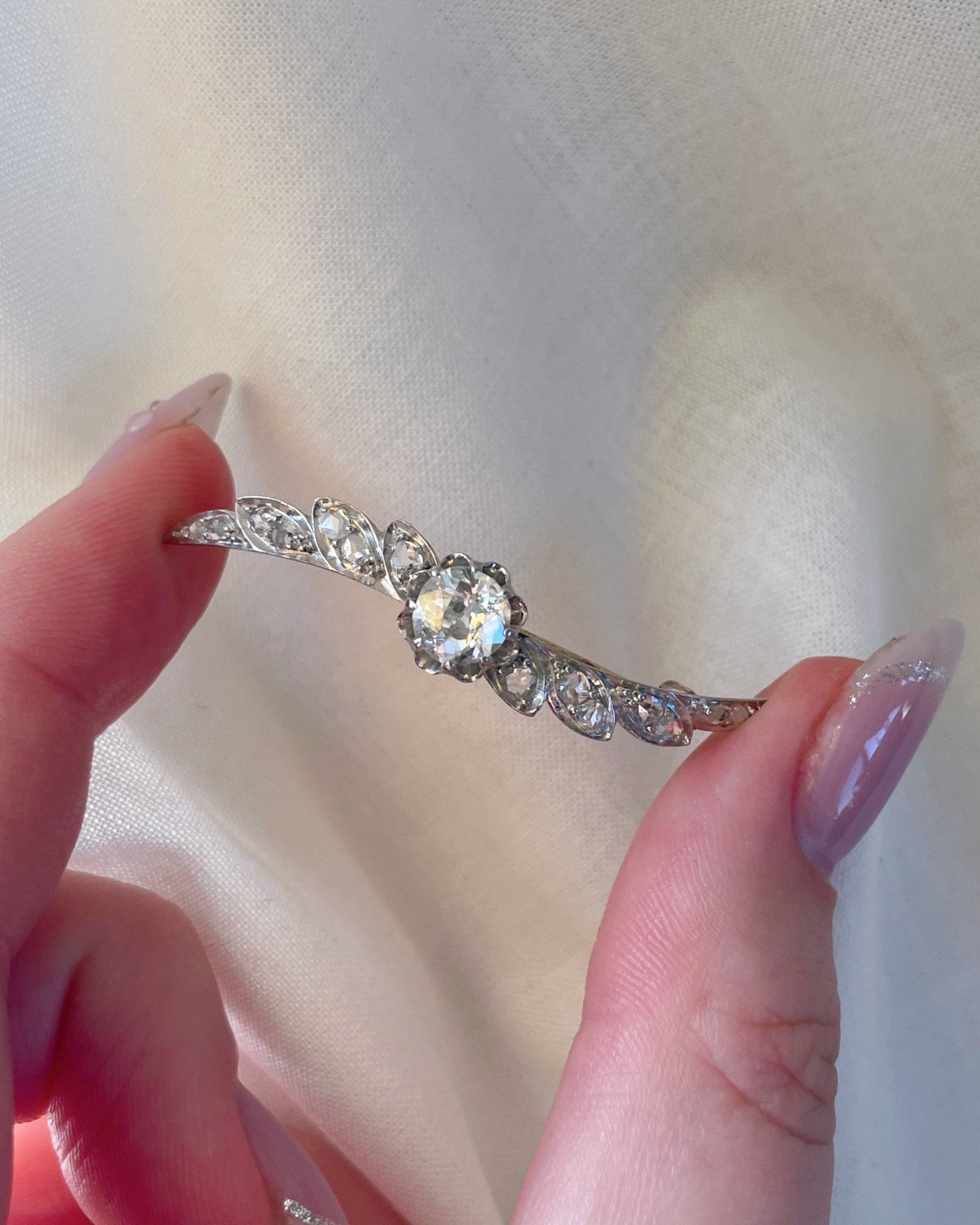 Edwardian Platinum, 14k Rose Gold, and Diamond Winged Brooch - Clover Collective Antiques