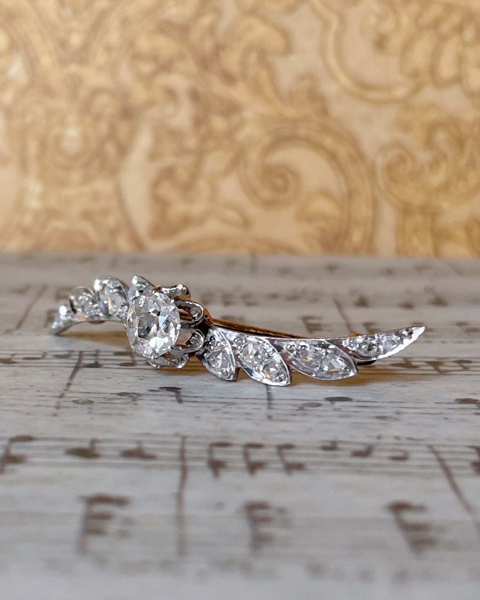 Edwardian Platinum, 14k Rose Gold, and Diamond Winged Brooch - Clover Collective Antiques