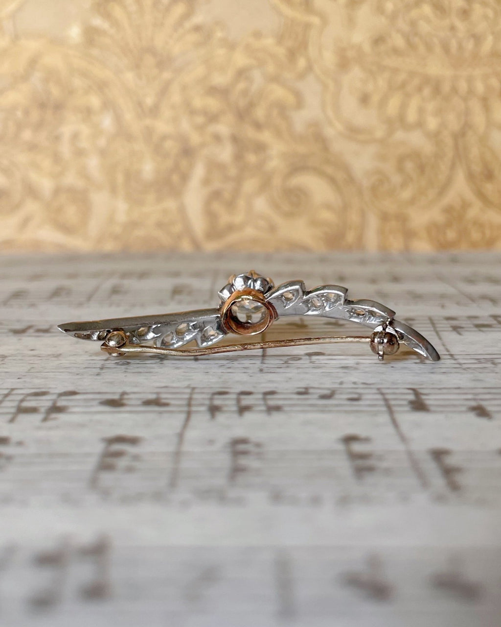 Edwardian Platinum, 14k Rose Gold, and Diamond Winged Brooch - Clover Collective Antiques