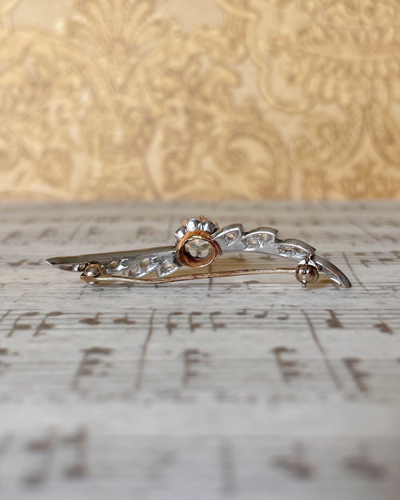 Edwardian Platinum, 14k Rose Gold, and Diamond Winged Brooch - Clover Collective Antiques
