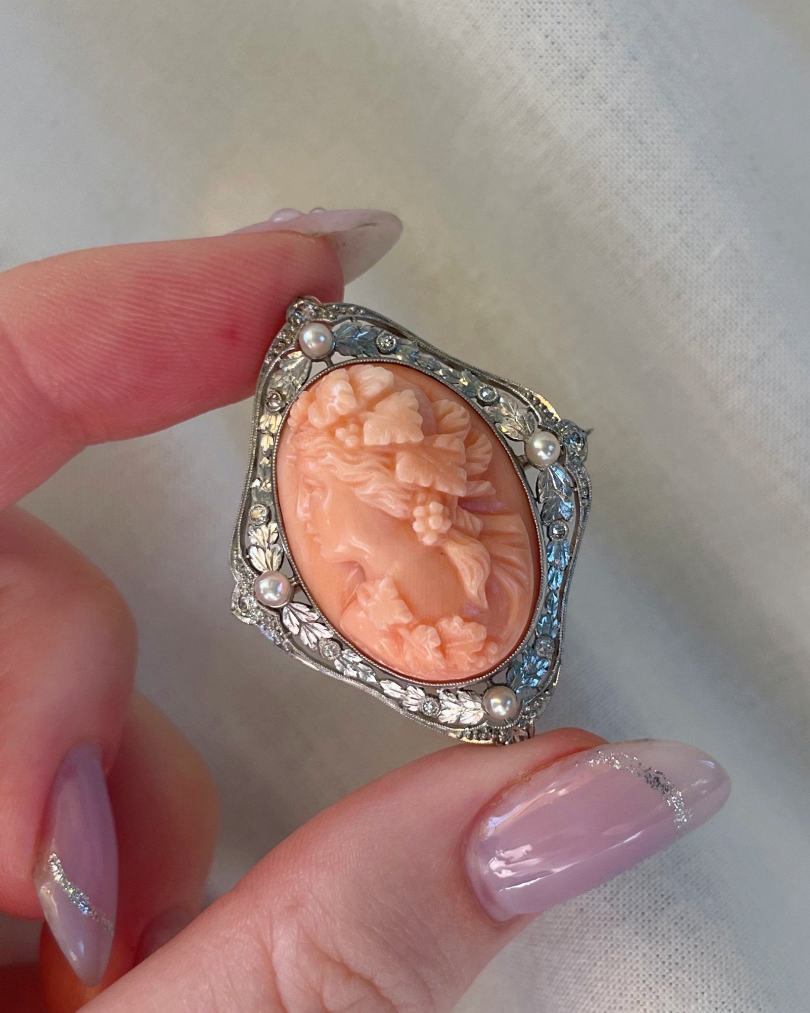 Edwardian Platinum, Diamond, Pearl, and Coral Cameo Brooch - Clover Collective Antiques