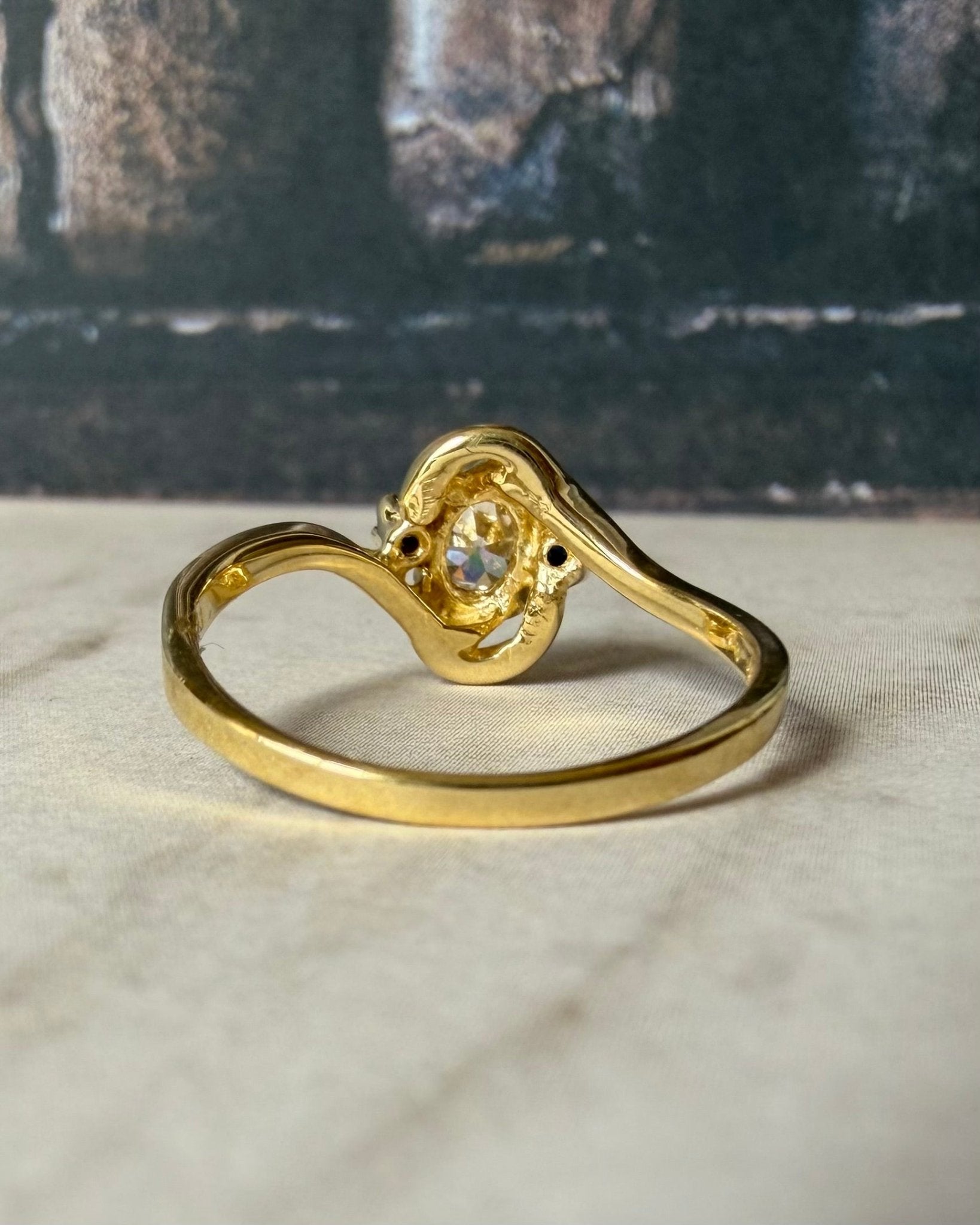Mid - Century 14k Yellow Gold, Old European Cut Diamond, and Sapphire Bypass Swirl Ring - Clover Collective Antiques