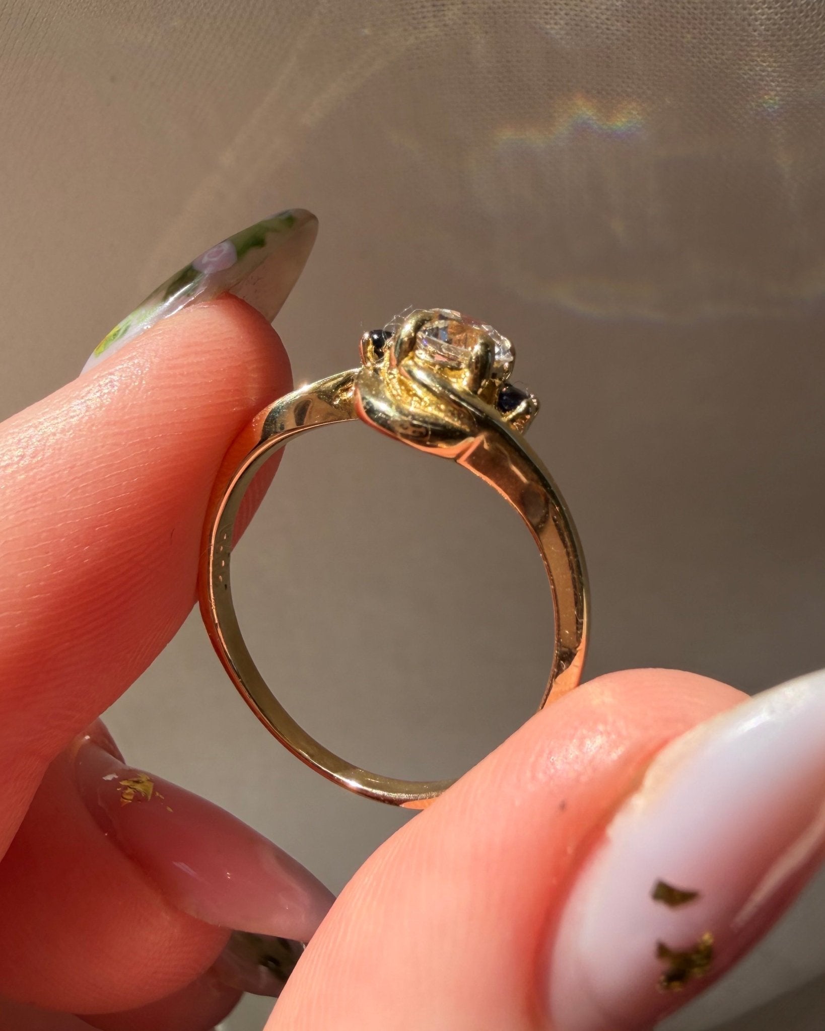 Mid - Century 14k Yellow Gold, Old European Cut Diamond, and Sapphire Bypass Swirl Ring - Clover Collective Antiques