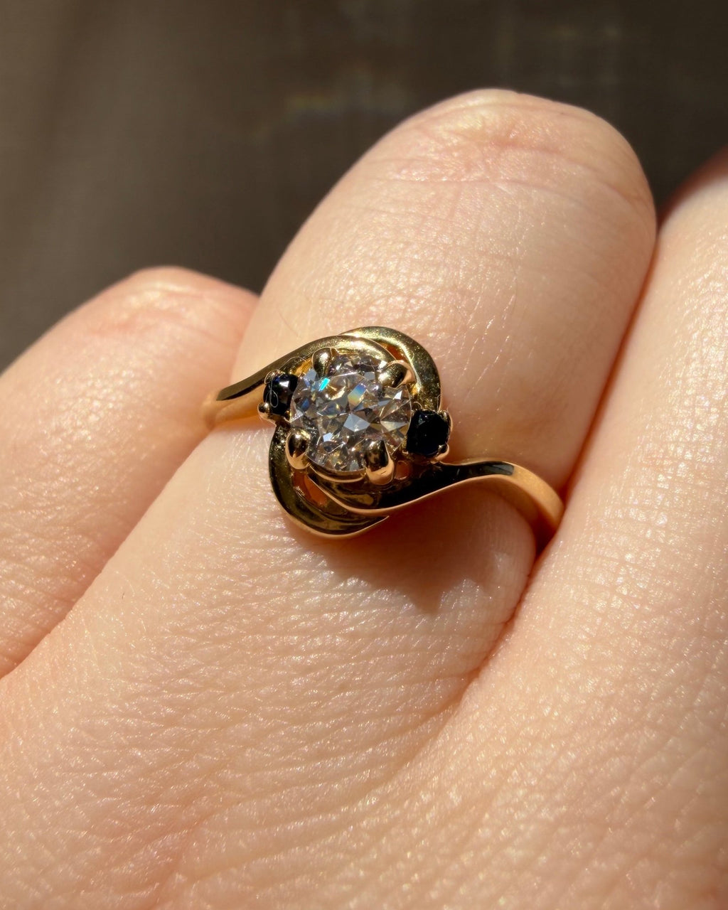 Mid - Century 14k Yellow Gold, Old European Cut Diamond, and Sapphire Bypass Swirl Ring - Clover Collective Antiques