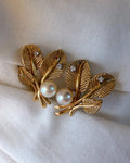 Pair of Mid Century 14k Yellow Gold, Pearl, and Diamond Flora Leaf Ear Clip Earrings - Clover Collective Antiques