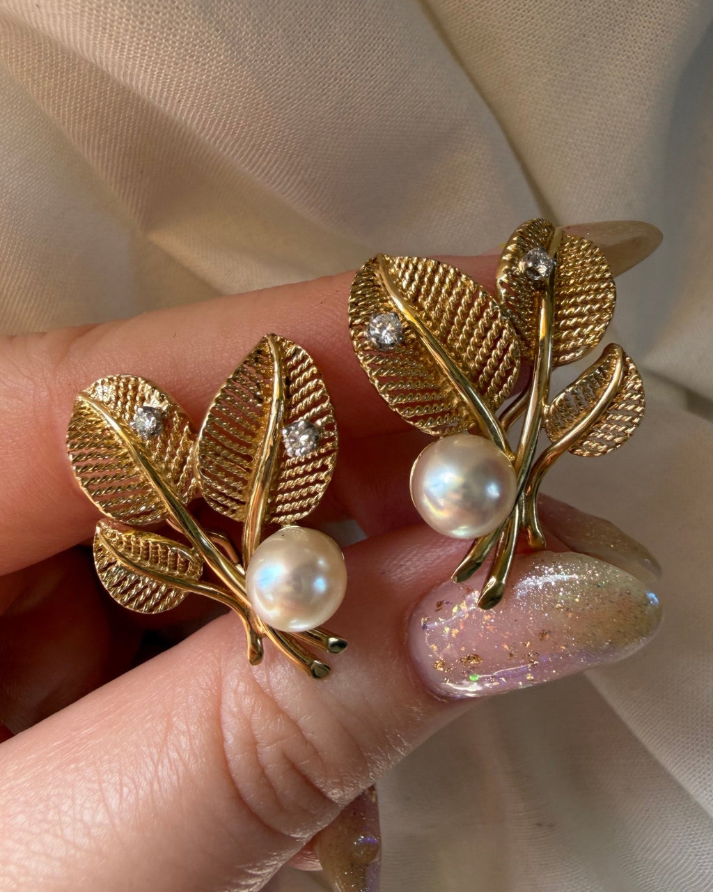 Pair of Mid Century 14k Yellow Gold, Pearl, and Diamond Flora Leaf Ear Clip Earrings - Clover Collective Antiques