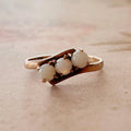 Retro Budlong, Docherty & Armstrong 10k Rose Gold and Opal Three Stone Bypass Ring - Clover Collective Antiques