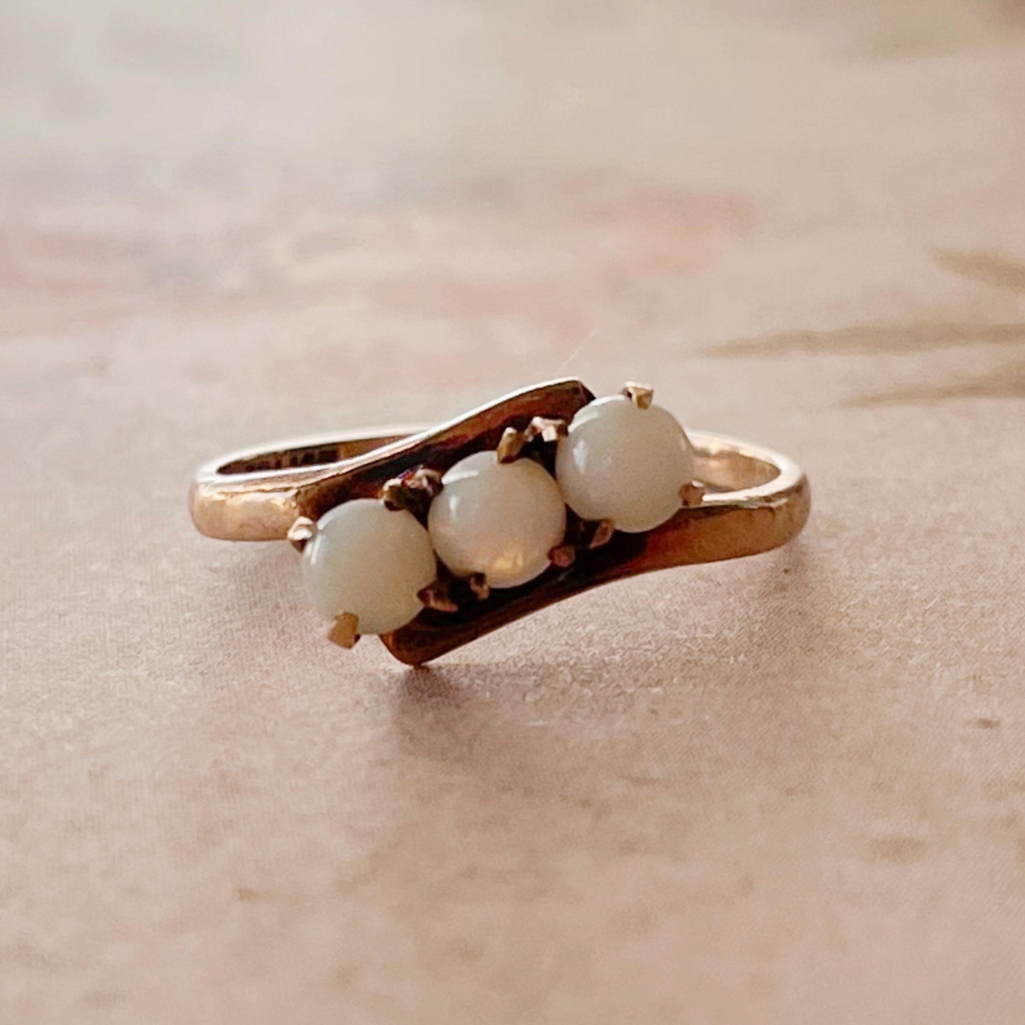 Retro Budlong, Docherty & Armstrong 10k Rose Gold and Opal Three Stone Bypass Ring - Clover Collective Antiques